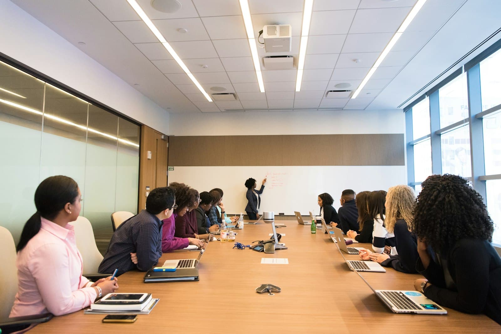 An institutional procurement team meeting in a boardroom