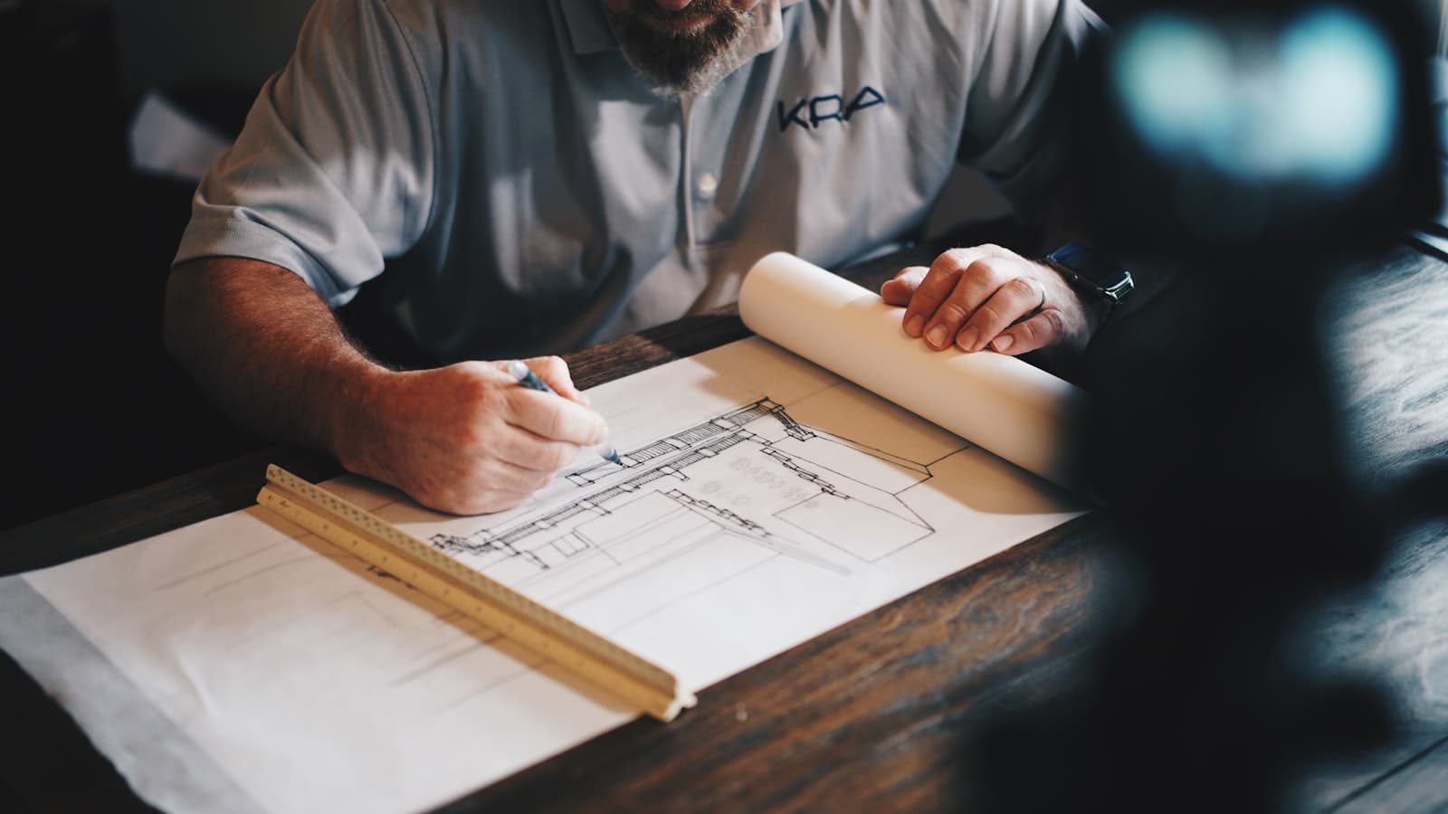 Project drawings being reviewed at a desk