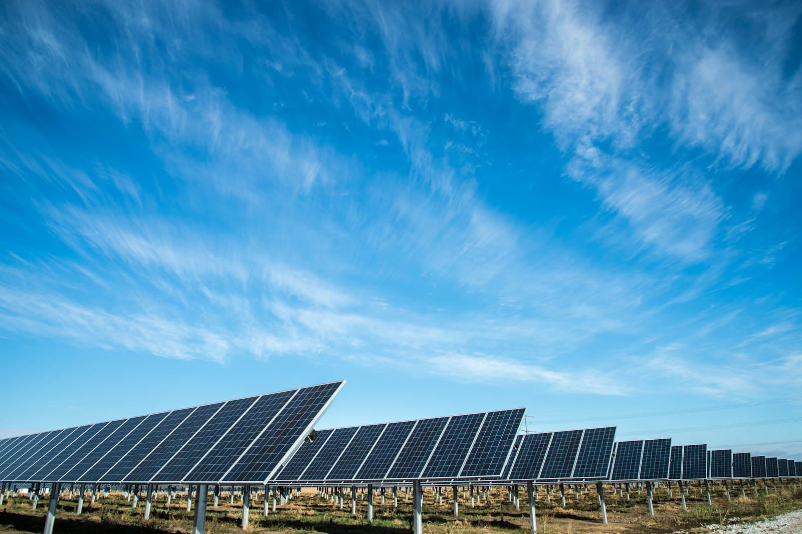 A ground-mounted solar array under a clear sky