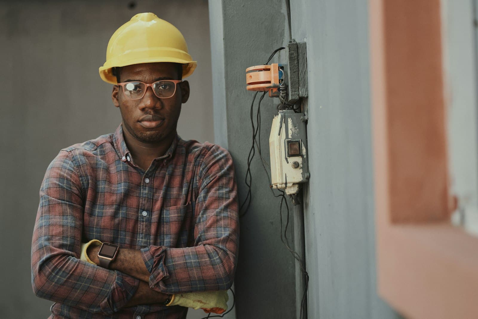 A supply coordinator in a hard hat on site
